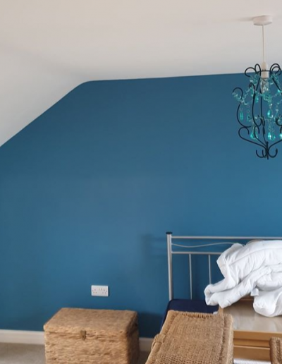 Blue feature wall created with modern decorating services
